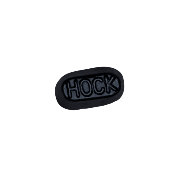 schwarzes Weingummi mit der Aufschrift "Hock"