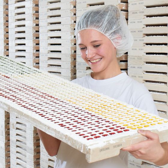Employee examining fully moulded fruit gummy figures