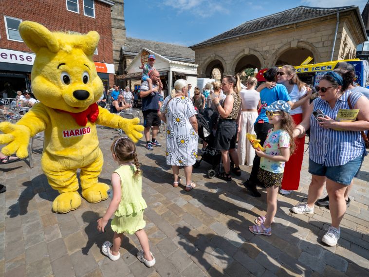 HARIBO Goldbear mascot interacts with the public.