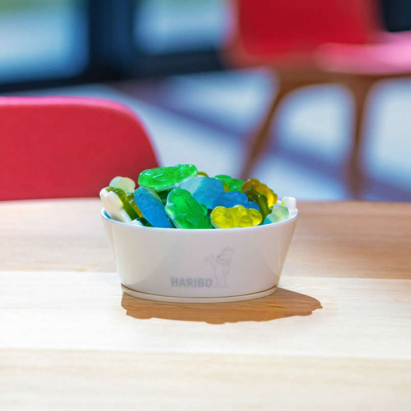 Colourful HARIBO pieces in a bowl on a table