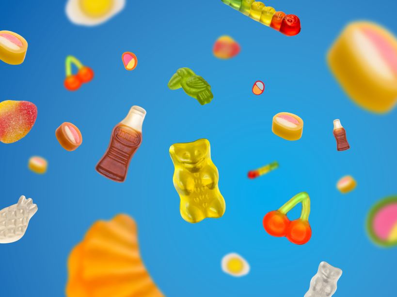 Colorful HARIBO product pieces flying around