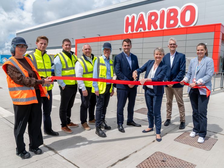 HARIBO colleagues and MP Yvette Cooper cut the ribbon outside a new HARIBO warehouse.