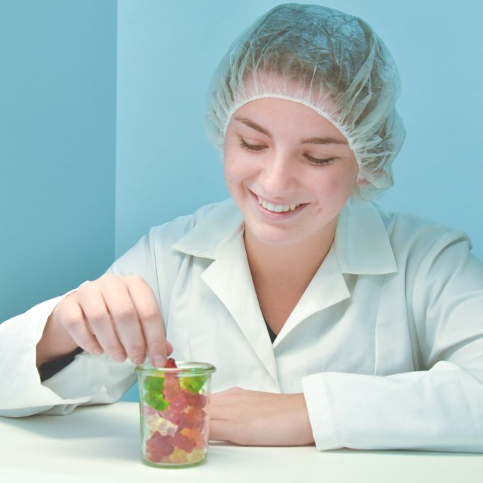 An employee testing HARIBO products
