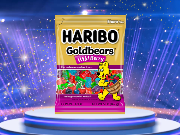 A bag of Wild Berry Goldbears is featured on a podium with sparkling lights behind it