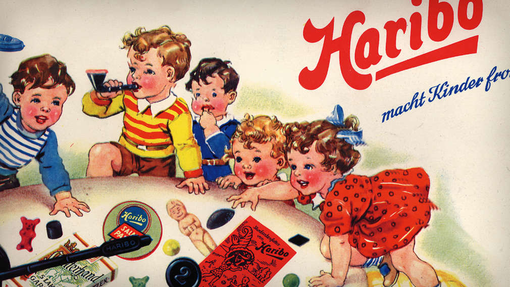 Historic HARIBO advert with kids enjoying fruit gummies and liquorice specialties.