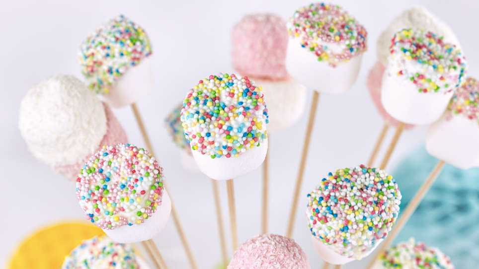 Close-up of decorated marshmallows on a stick