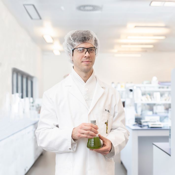 Employee in lab checking raw materials
