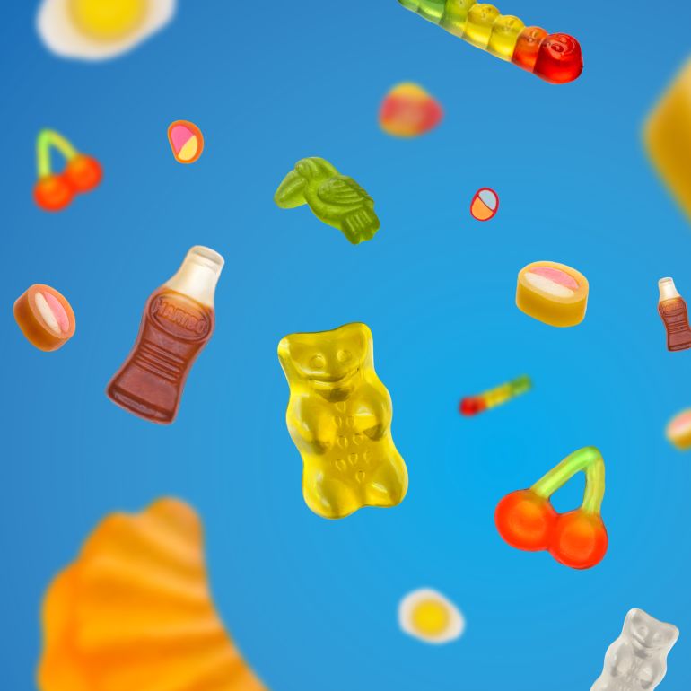 Colorful HARIBO product pieces flying around