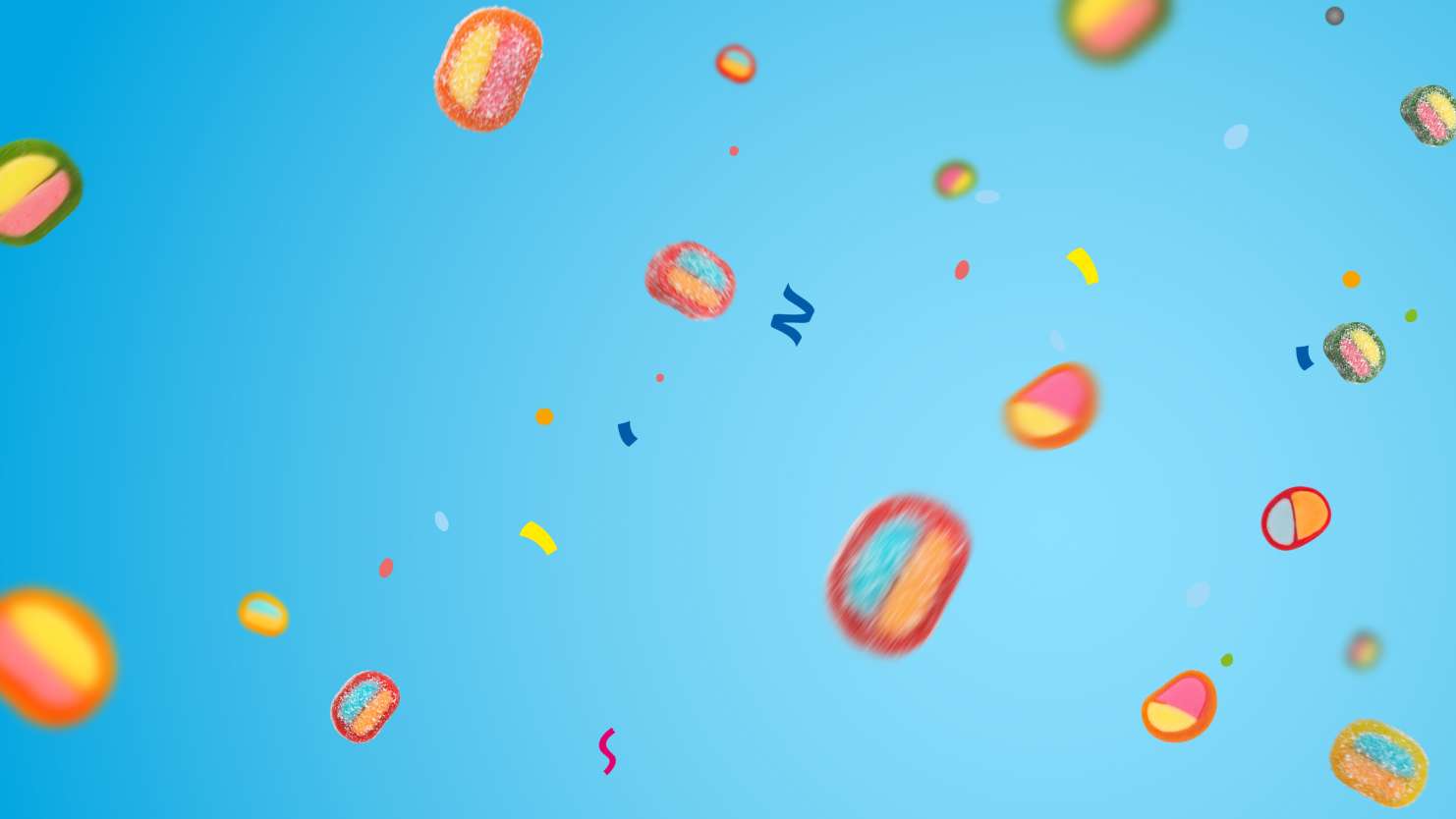 HARIBO Pico-Balla Produktstücke schweben schwerelos vor blauem Hintergrund