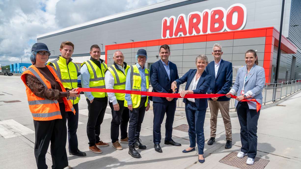 HARIBO colleagues and MP Yvette Cooper cut the ribbon outside a new HARIBO warehouse.