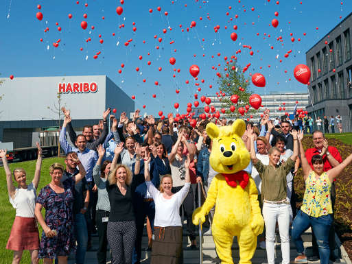 HARIBO employees with life-sized Goldbear at the Grafschaft site
