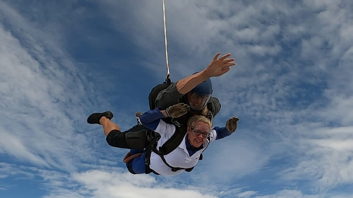 HARIBO colleague and instructor fall through the air at charity skydive.