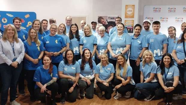 Members of the HARIBO and Martin House teams pose inside their joint pop-up shop.