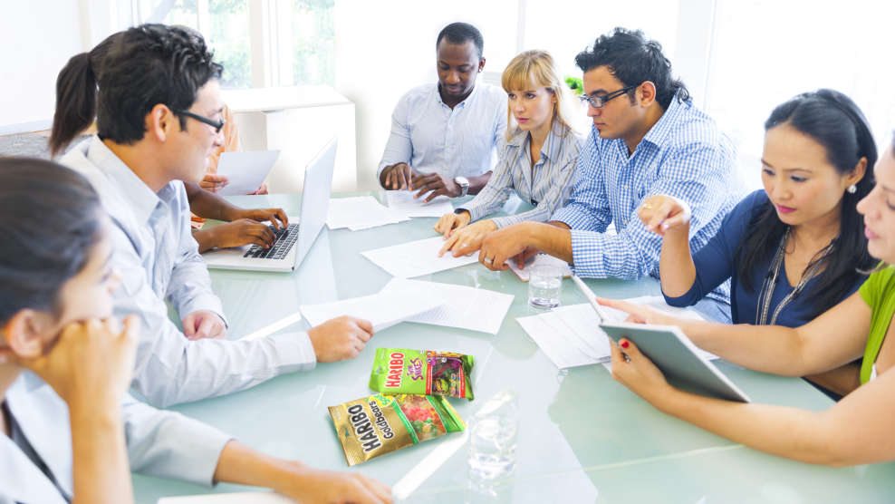 diverse team of employees discussing at a table