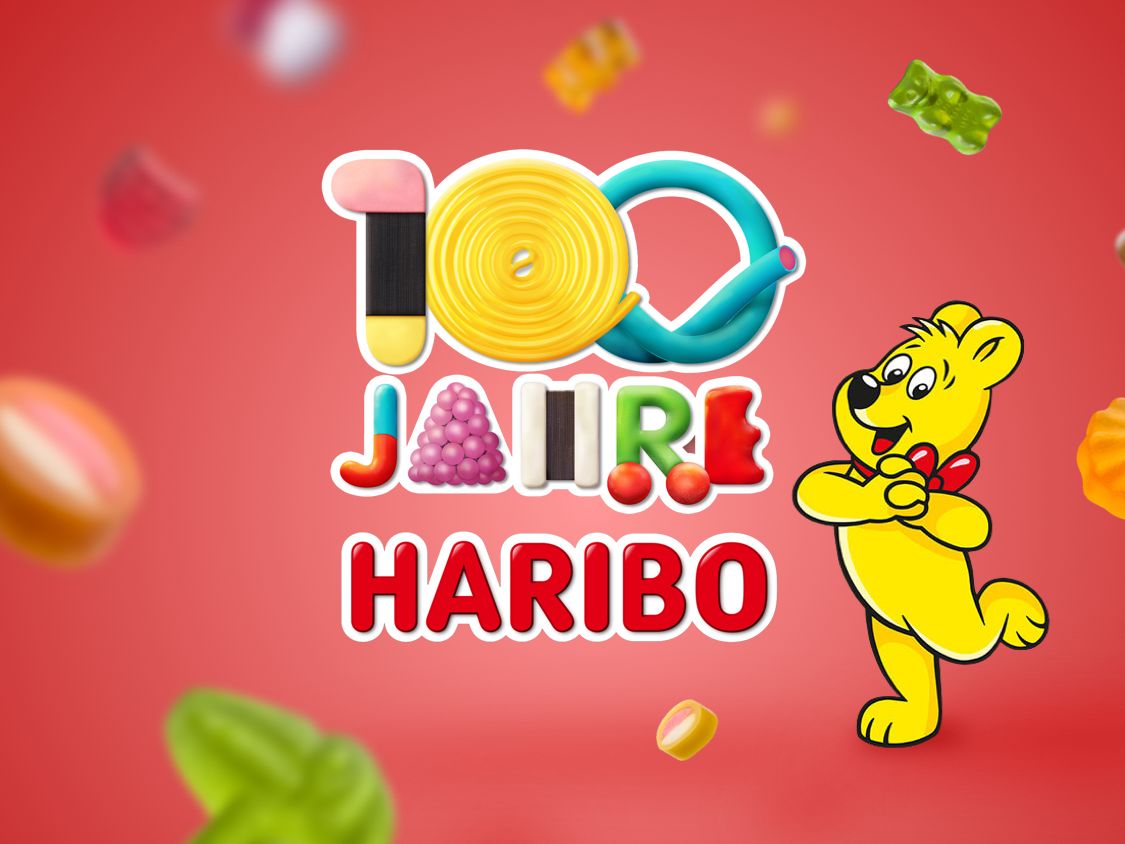 Schriftzug 100 Jahre HARIBO gelegt aus Produktstücken mit Goldbär
