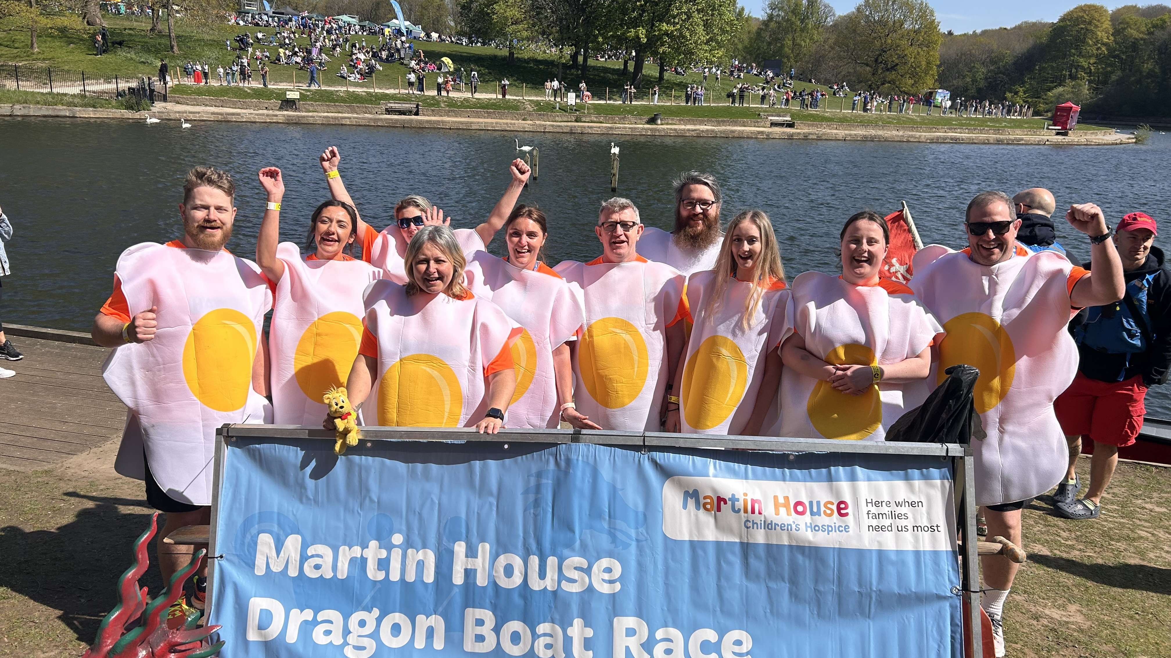 Rowing team dressed as Fried Eggs celebrate.